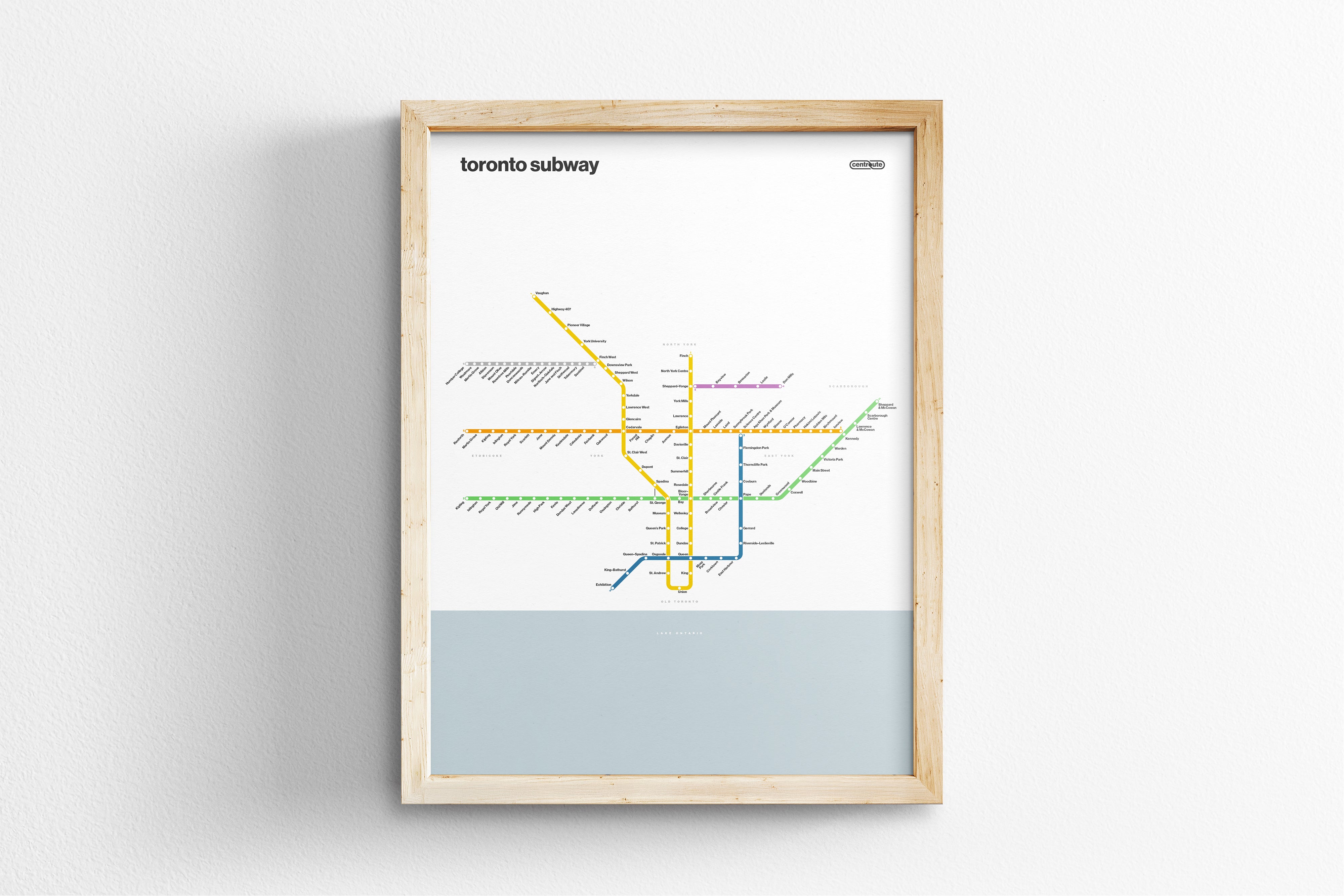 A framed subway map of Toronto, Canada, depicting the underground transit system.
