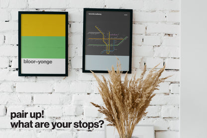 a white brick wall with two framed posters hanging on it, one depicting a subway map and the other showing a yellow and green color scheme. There is also a vase of dried grasses placed on the wall. The image includes text that reads "What are your stops?"