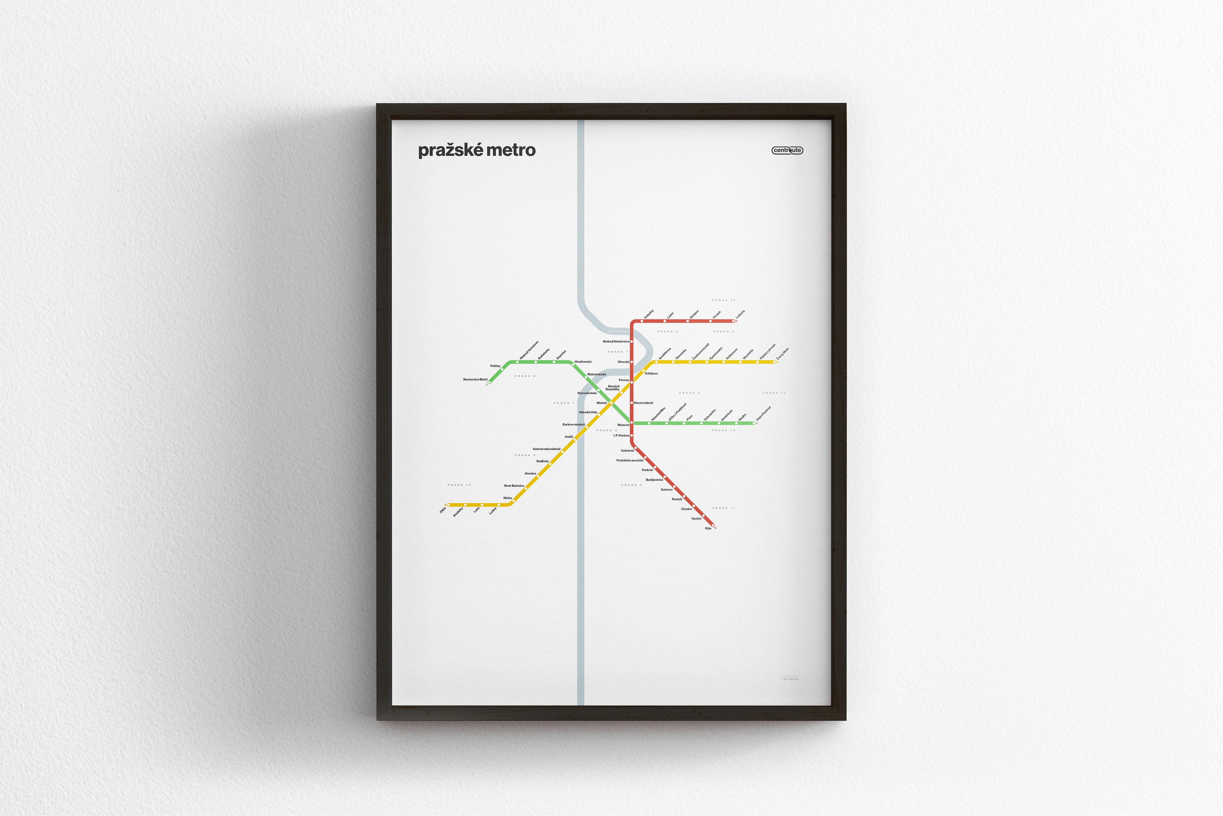 The image is a framed subway map of a city, featuring a colorful and detailed design with various lines representing subway routes and stations.