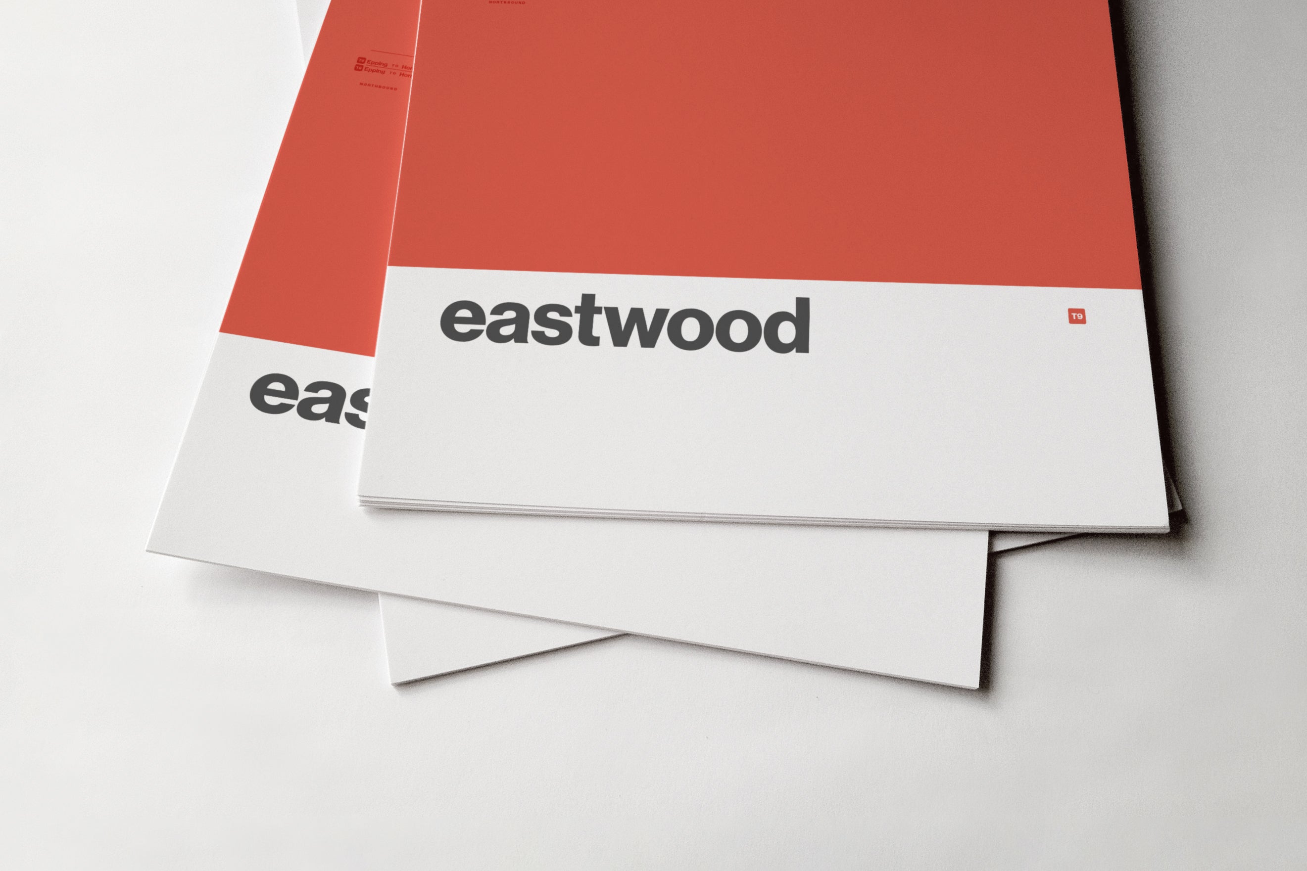 a stack of white and red papers or documents, with the word "eastwood" printed on them.