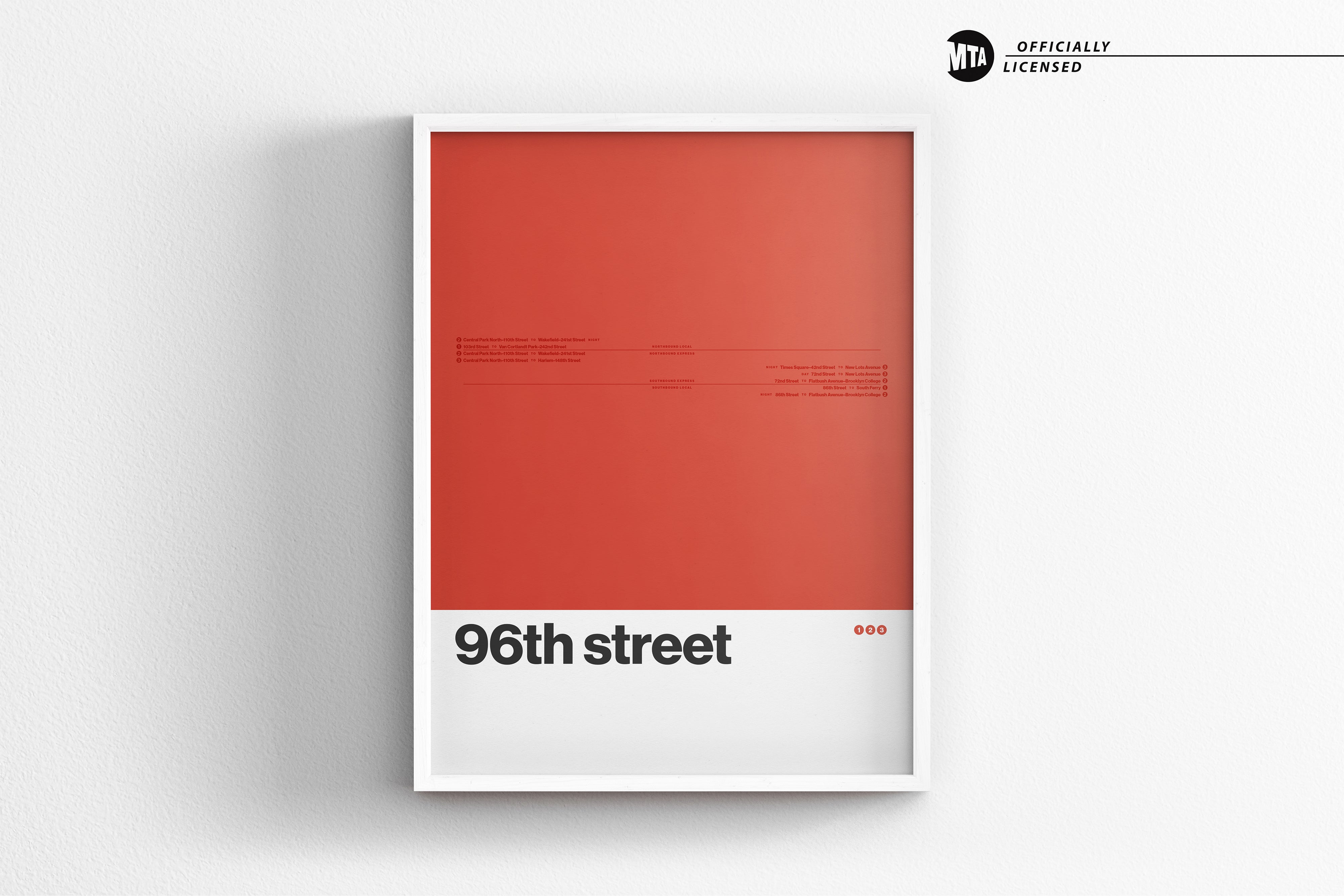 A framed poster with a red background and white text, displaying the text "96th street" and "oo" in the bottom right corner.