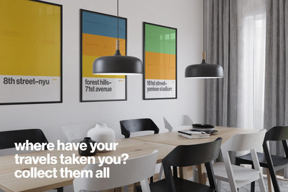 a modern dining room with a wooden table and chairs, three framed posters on the wall, and a black pendant light hanging above the table.