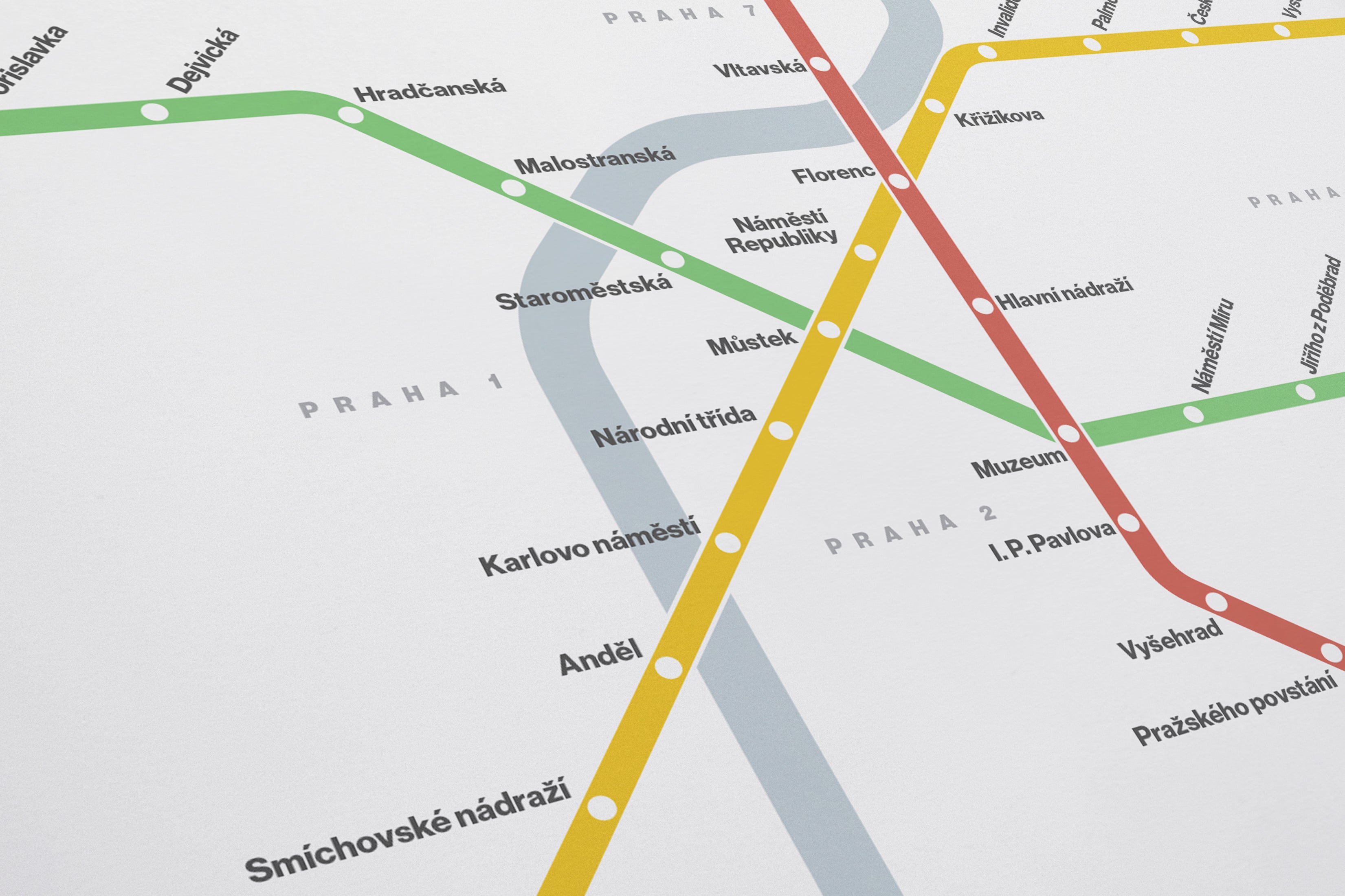 The image is a detailed subway map of Prague, Czech Republic, showing various lines and stations.