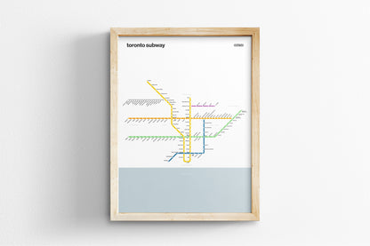 A framed subway map of Toronto, Canada, depicting the underground transit system.